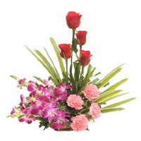 Send Online New Year Flowers to Bengaluru containing Orchids, Roses, Carnation Basket of 12 Flowers to Bangalore