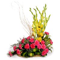 Same Day New Year Flower Delivery to Bangalore. 18 Pink Carnation and 6 Yellow Glad Basket Flowers Bangalore