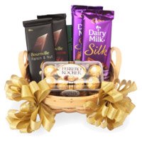 Buy New Year Gifts in Bengaluru incorporated with Silk, Bournville and Ferrero Rocher Basket of Chocolate to Bangalore Online