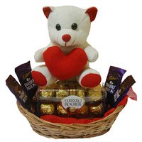 Deliver 4 Dairy Milk 16 Ferrero Rocher New Year Chocolates to Bangalore and 6 Inch Teddy Basket. Send Gifts to Bengaluru