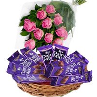 Deliver Online Dairy Milk Basket 12 Chocolates With 12 Pink Roses to Bangalore