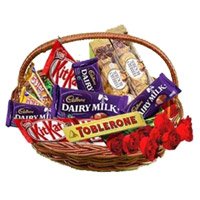 Order Basket of Assorted Chocolate and 10 Red Roses as Gifts to Bangalore Online to Bangalore on Raksha Bandhan