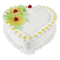 Send New Year Cakes to Bangalore with 1 Kg best Eggless Heart Shape Pineapple Cake in Bengaluru