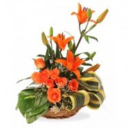 Order Online 3 Orange Lily 6 Orange Roses Basket 12 Rakhi Flowers to Bangalore