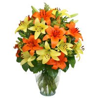 Online Flowers Delivery in Bengaluru. Buy Yellow Orange Lily Vase 20 Flower Stems for Friendship Day